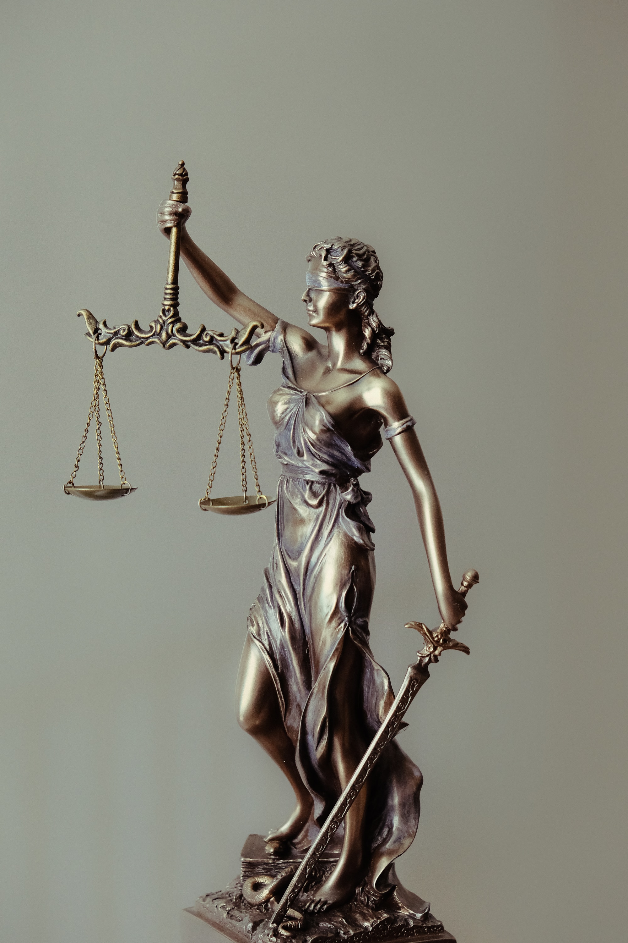 Image of lady justice holding scales. Representing you in civil court cases to help you navigate the court system. 