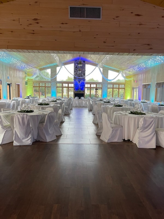 Wedding lighting at the Northern Pines Golf Center in Iron River, WI. lighting by Duluth Event Lighting. Up lighting in a two tone blue and mint green.