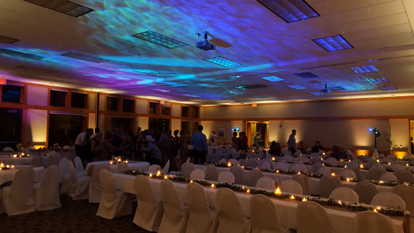 Heartwood Event Center in Trego. Lower level room.
wedding lighting in warm white with Northern Lights on the ceiling.