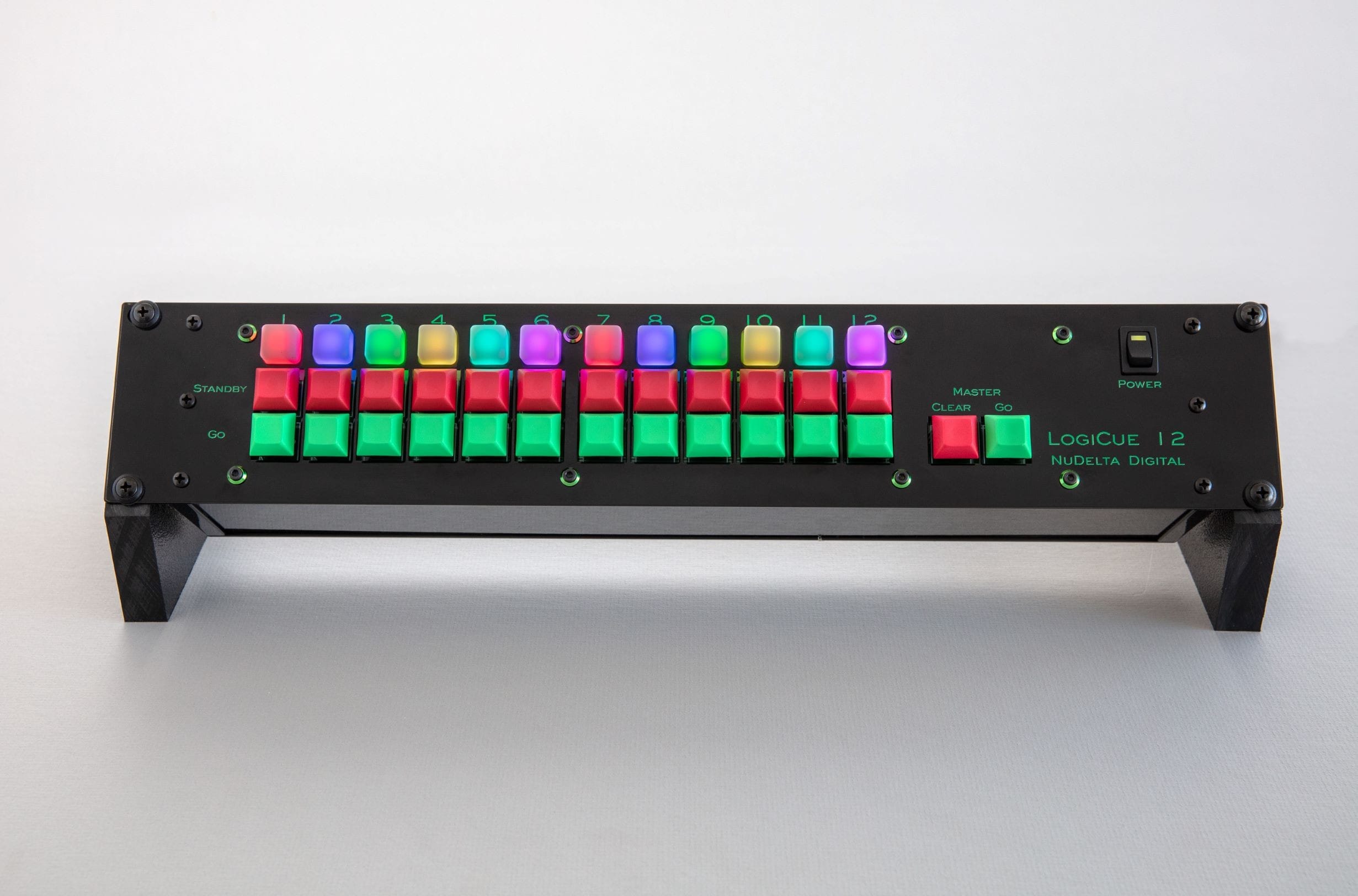 A picture of the LogiCue 12 Digital Cue Light Controller turned on and each light emitting diode illuminated in a different color.