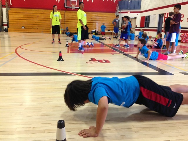 A Kid Doing Warm-Up Excerises