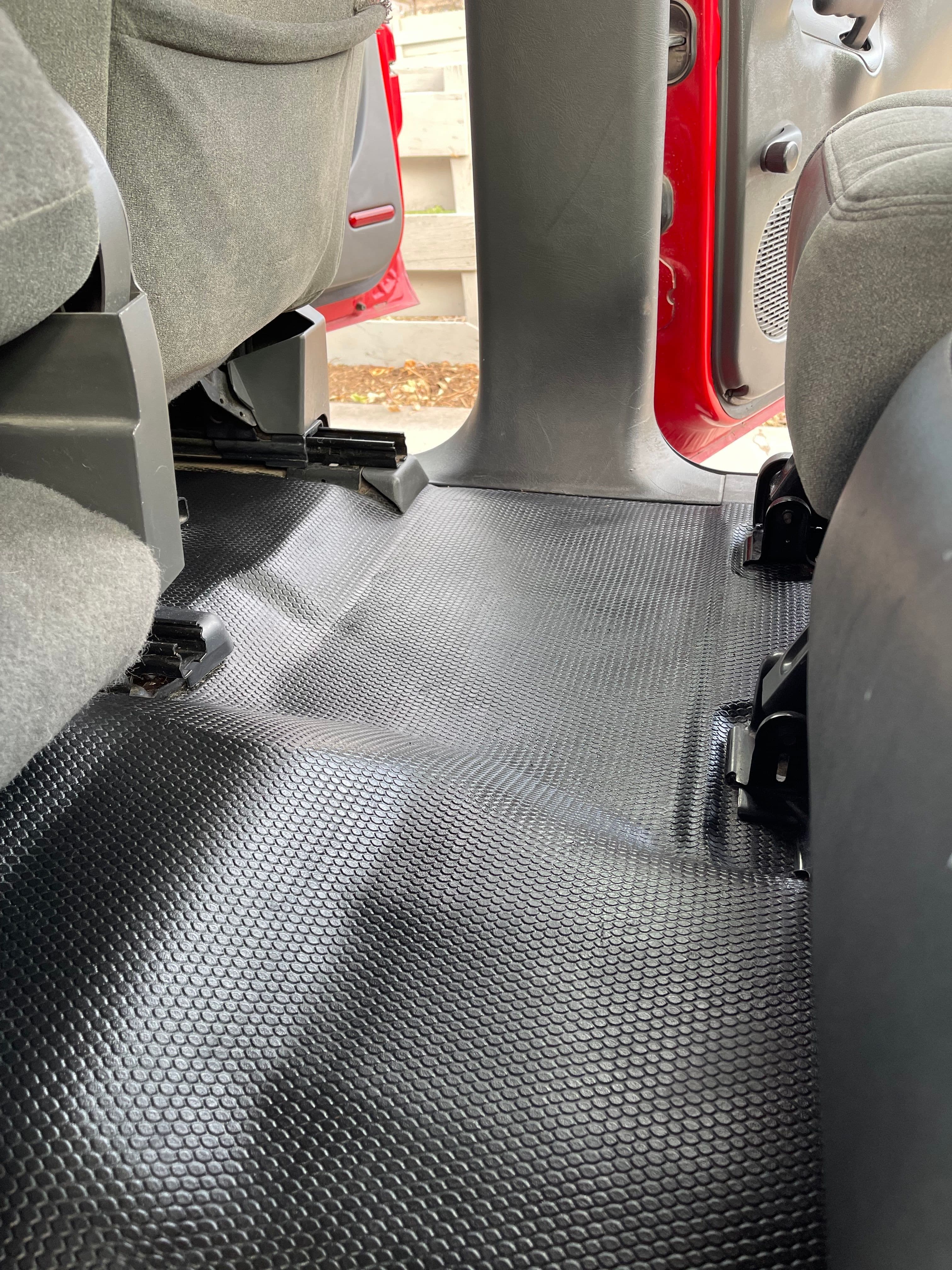 This vehicles plastic flooring has been cleaned, and as requested by the customer,dressed with an interior dressing