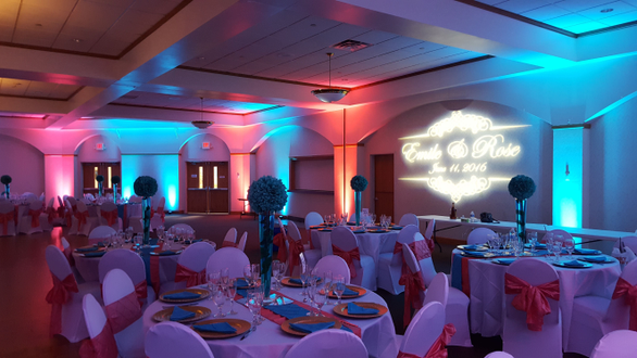 Cedars Hall in Minneapolis. Wedding lighting in teal and coral with a monogram.