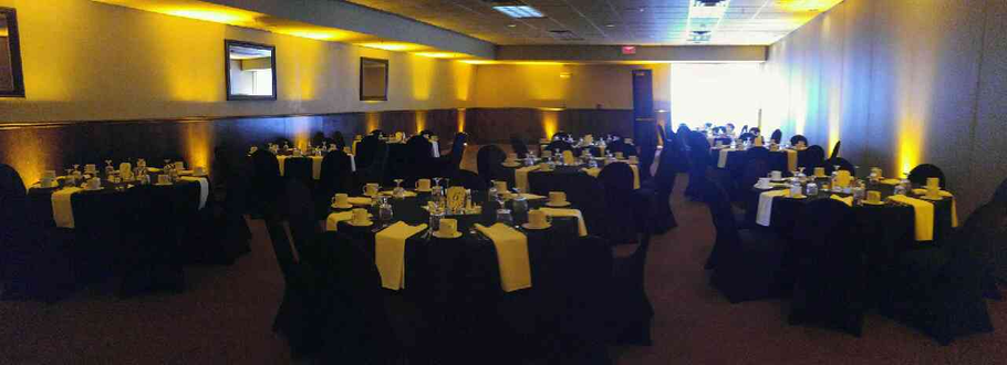 Up lighting in yellow at Blacwoods event center in Proctor.
