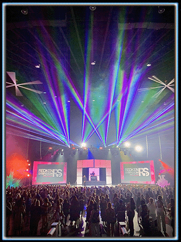 Laser beams projected over the audience for a corporate party.