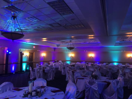 Wedding lighting in teal and deep purple with stars & Northern Lights at the Inn on Lake Superior.