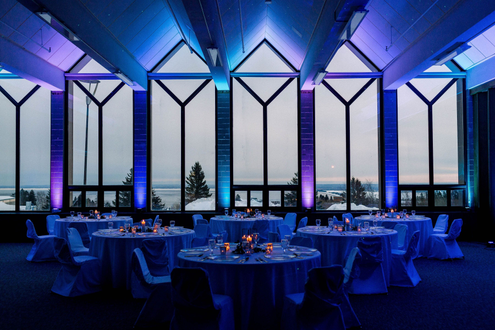 Photo byMarya Juliann Photography. Northern Lights up lighting theme. Up lighting in blue, teal and purple. Decor byPure Event Planning & Design.