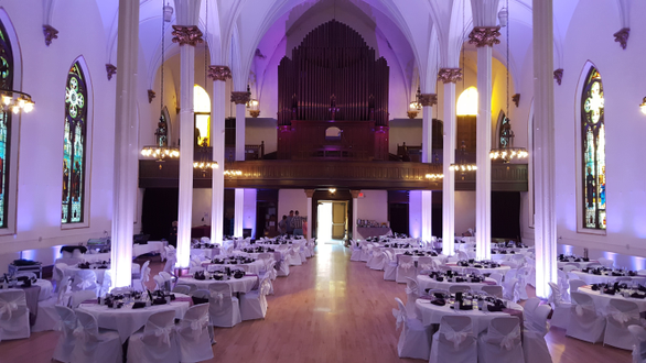 Sacred Heart Music Center,
Lavender purple up lighting for a wedding.