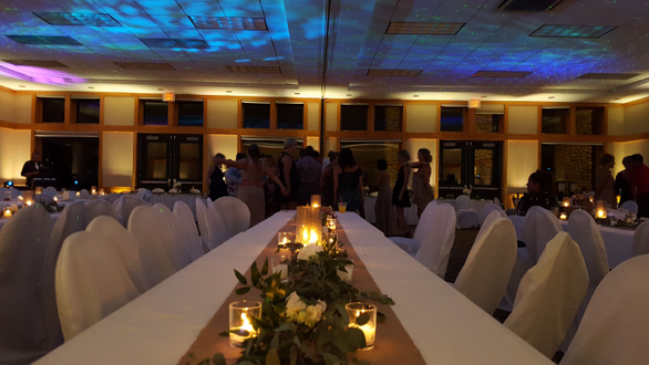 Heartwood Event Center in Trego. Wedding lighting in warm white with Stars and Northern Lights on the ceiling.