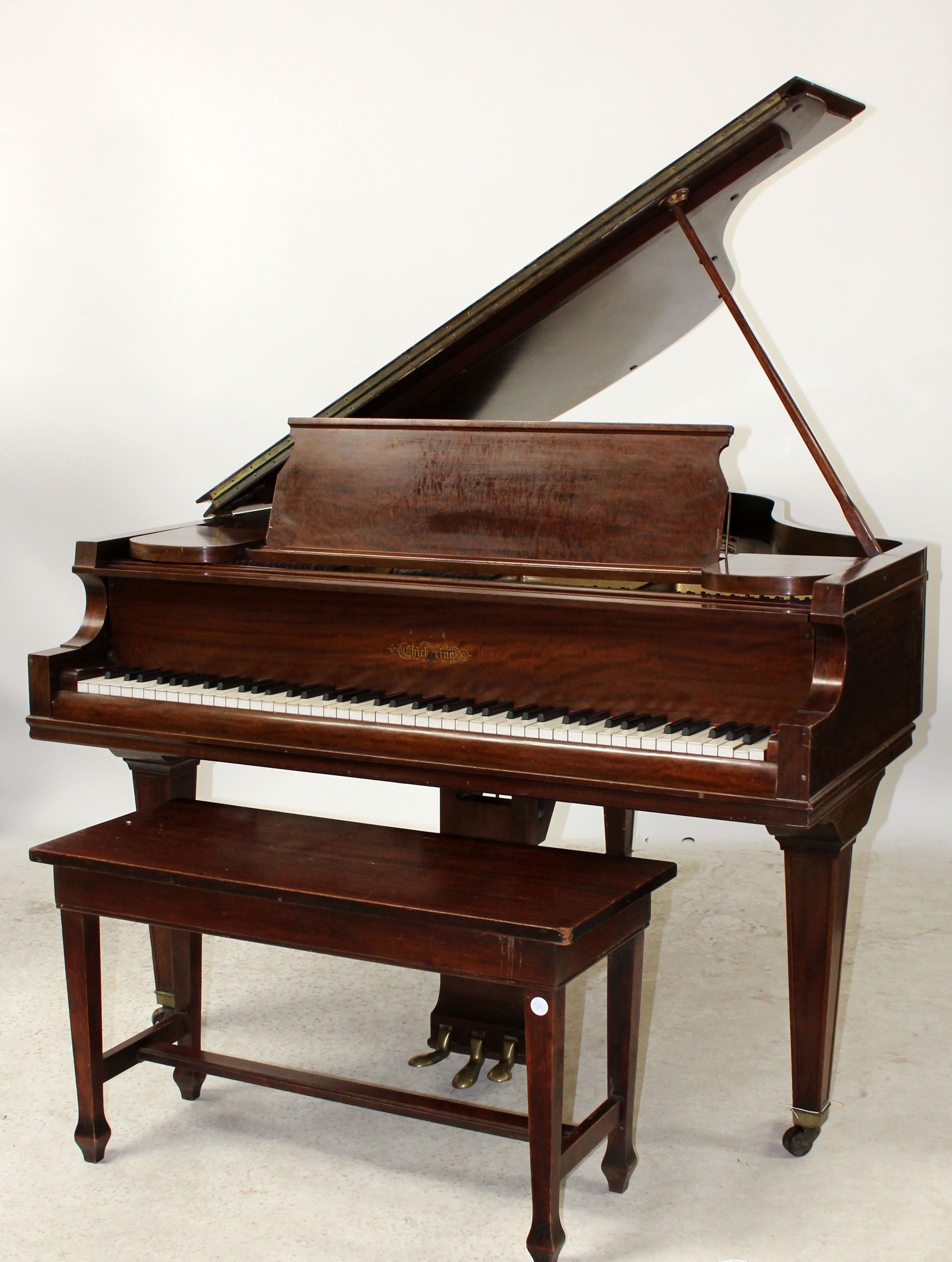 Chickering baby grand piano in mahogany. With bench. Serial no. 130629.
