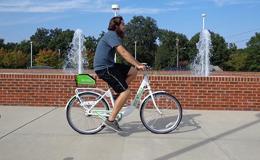 Male college student on share bike