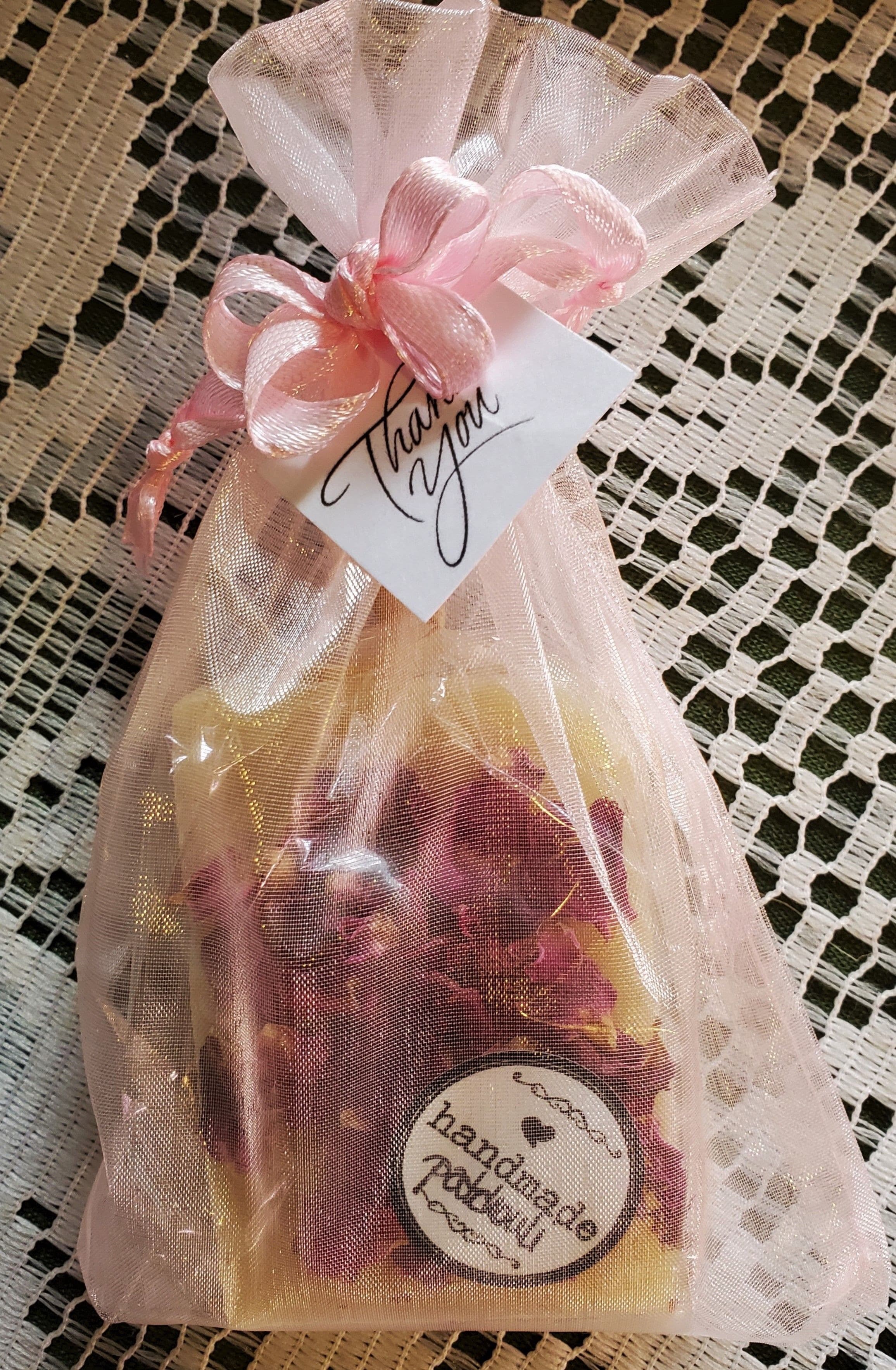 All natural handmade soap gifts decorated with organic botanicals.  This elegant little soap gift is delivered in a cute organza bag; inexpensive and adorable.