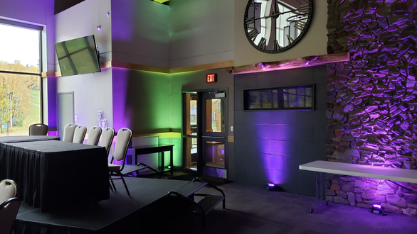 Wedding lighting at Giants Ridge with mint green and purple up lighting by Duluth Event Lighting.