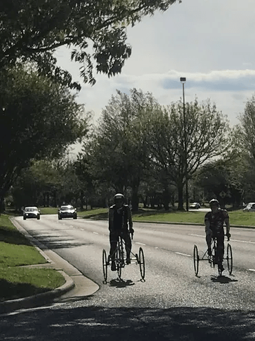 Two People Cycling