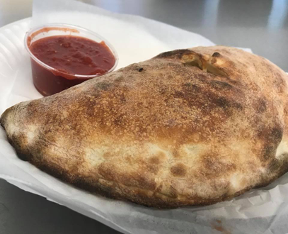 Calzone with sideof sauce
