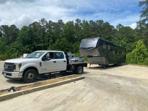 alt= "Image of a Fifth wheel trailer being transported"