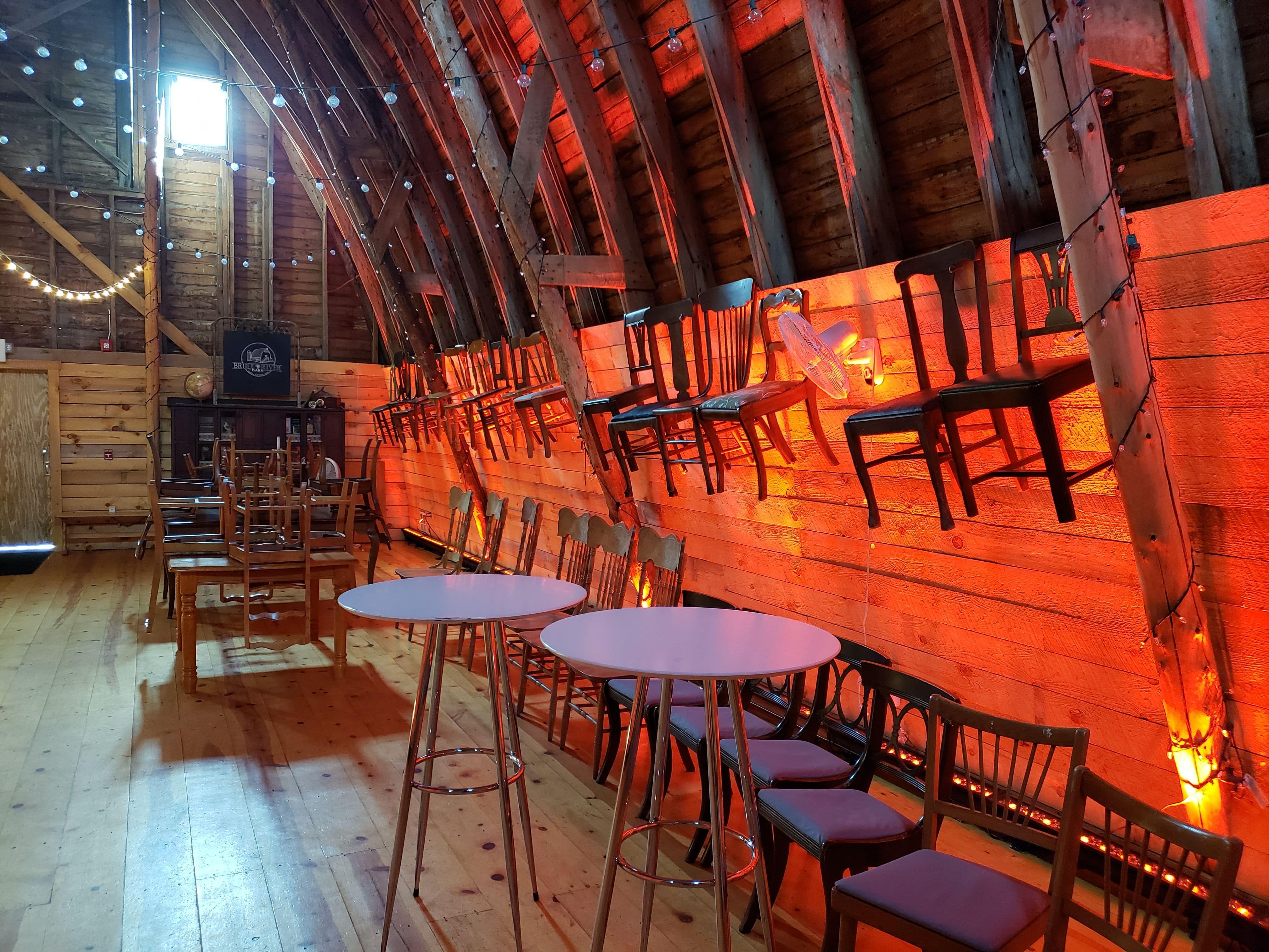 Wedding lighting at the Brule River Barn. Up lighting in red.