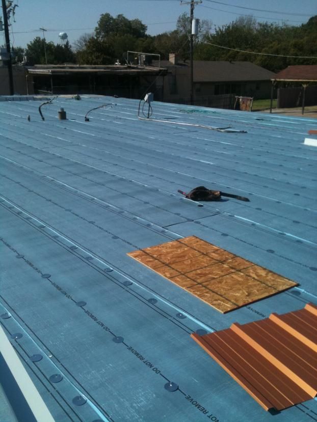 Before a completed commercial roofing company project in the  area