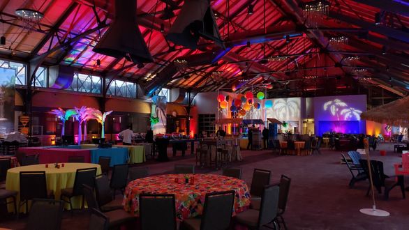 Renaissance Minneapolis, The Depot. Up lighting in warm tones with palm tree gobos, backdrop lighting. Decor by Event Lab