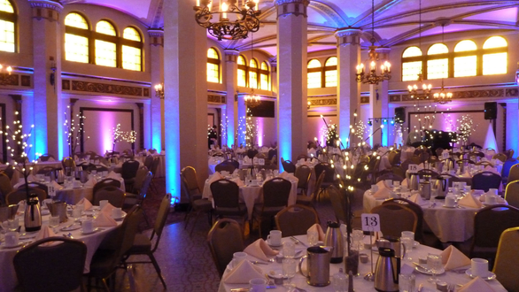 Wedding in the Moorish Room. Northern Lights theme with blue and magenta up lighting with stars.