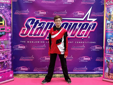Winning Boy Dancer from Studio L Dance, llinois on awards stage at Starpower competition shown in Dance Team Custom Warmups by CF