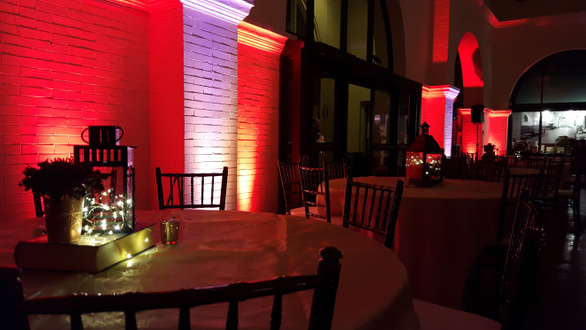 Wedding lighting with red and white up lighting.