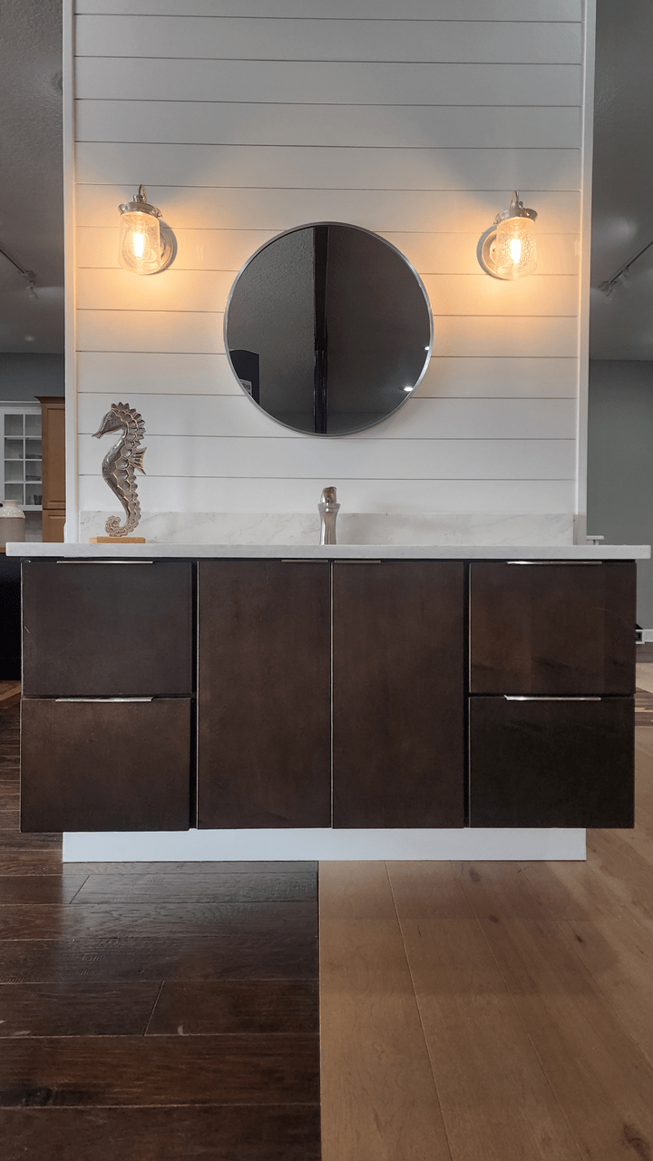 Floating vanity in a sleek and modern style featuring flat slab cabinet doors in a deep and rich darkwood, topped with a gorgeous quartz countertop.
