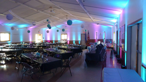 Wedding lighting in teal and magenta.