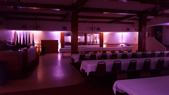 Up lighting in peach and lavender for a wedding at the Elks Lodge in Superior.
