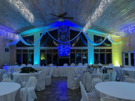 Northern Pines Golf Center in Iron River, WI. Wedding lighting in a two tone blue and mint green by Duluth Event Lighting.