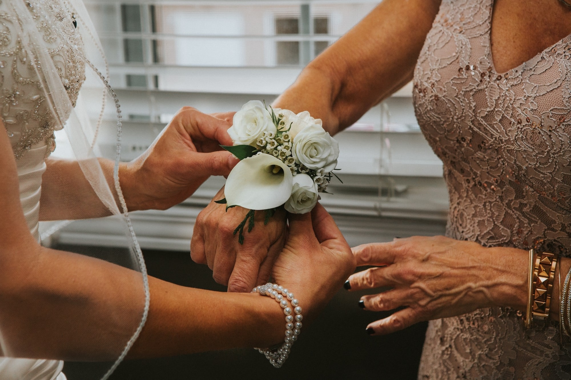 The Mother of the Bride may choose to place the veil on the Bride before the wedding ceremony to symbolize her last task that a Mother does on behalf of her gir
