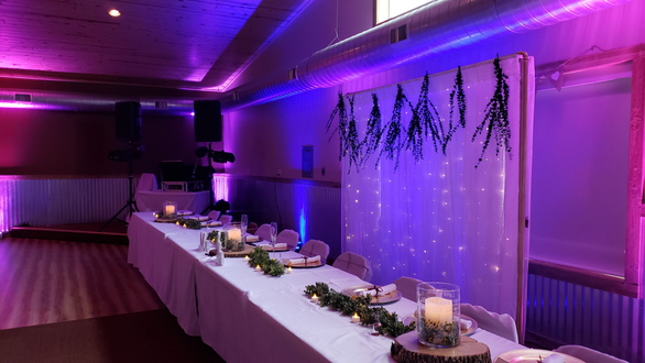 Wedding lighting in blue, purple and magenta at the Buffalo House Event Center.