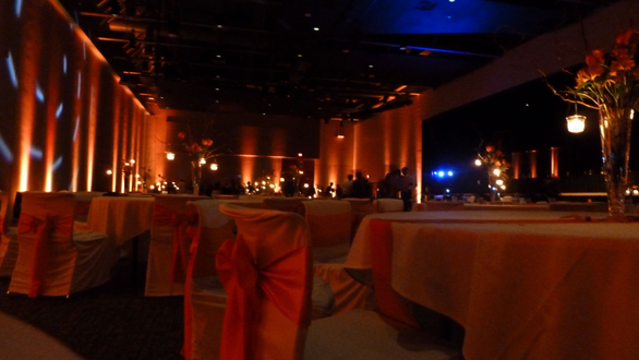 Fall wedding theme with orange up lighting at Black Bear Casino.