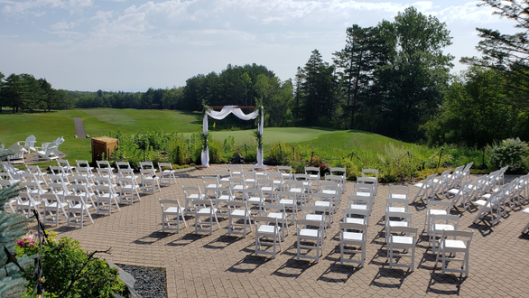 The patio set up for a wedding ceremony at the Northland Country Club. Garden bistro.