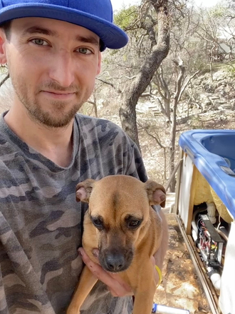 Taylor holds chihuahua Snowmoon at a service site on the lake.