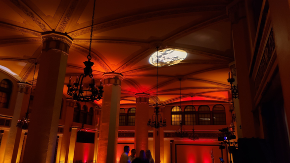 A Fall color theme wedding in the Moorish Room. Up lighting in amber, orange and red with a harvest moon on the ceiling.