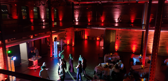 Clyde Malting Building wedding. Up lighting in blush pink and red. Venue's bistro off in this photo.