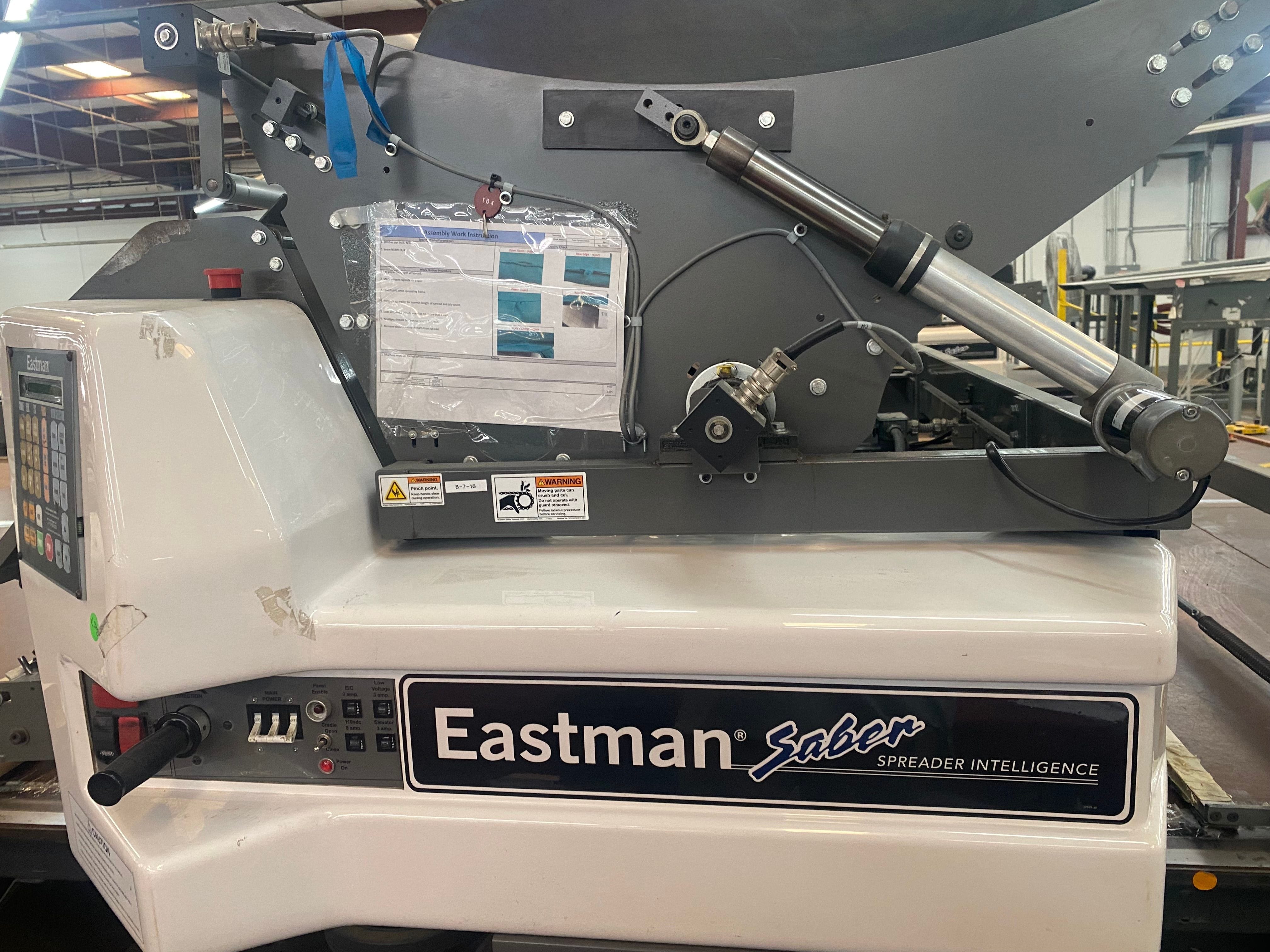 EASTMAN
MODEL: SABER ST-C-250-0011
AUTOMATIC SPREADING MACHINE
MAXIMUM ROLL WIDTH: 72"
MAXIMUM ROLL WEIGHT: 250 LBS.
YEAR OF MANUFACTURE: 2014