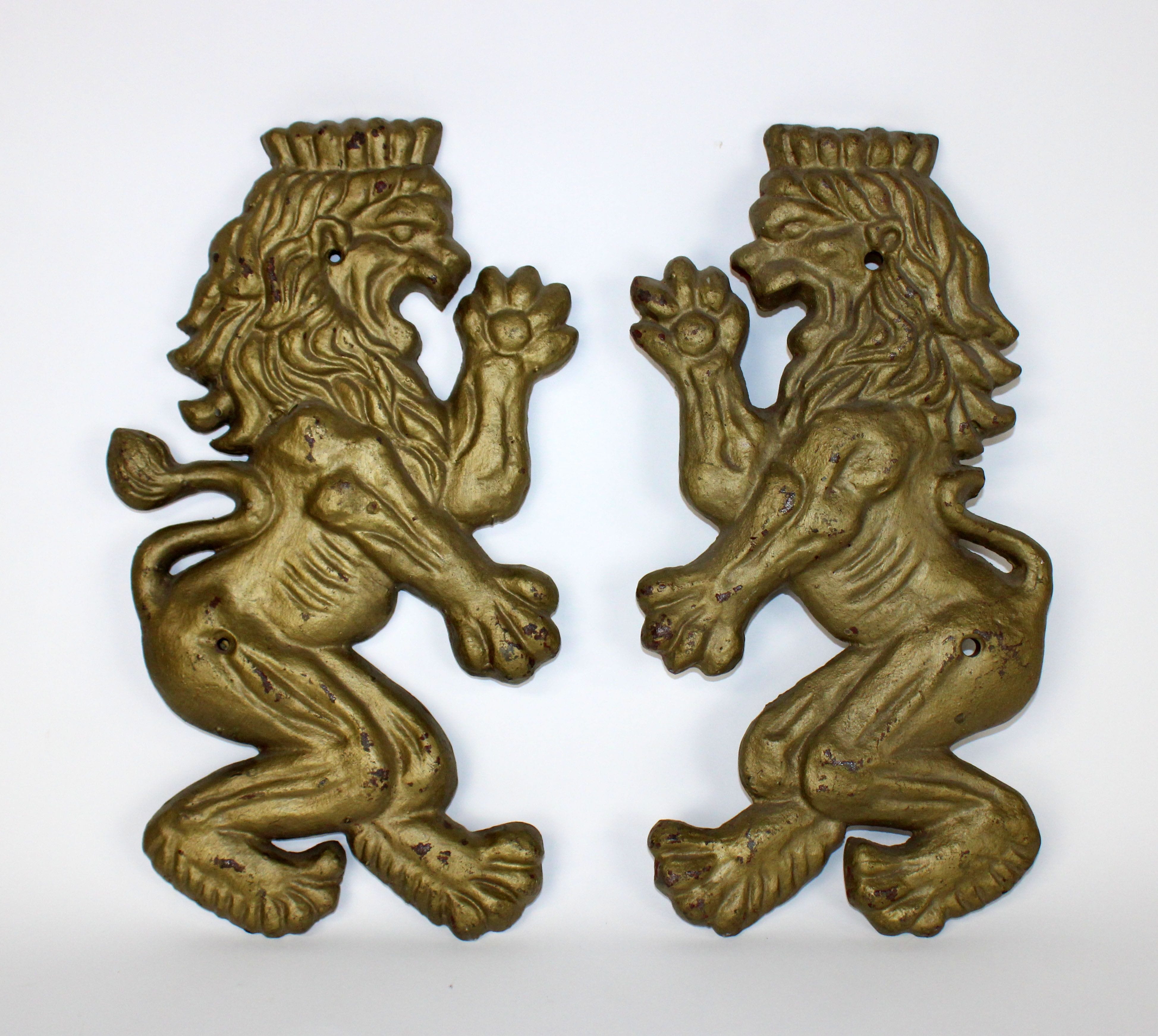 Pair of painted gilt metal regal lion plaques