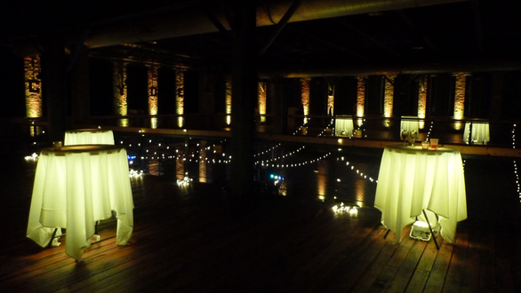 wedding lighting at Clyde Iron Works with glowing cocktail tables.