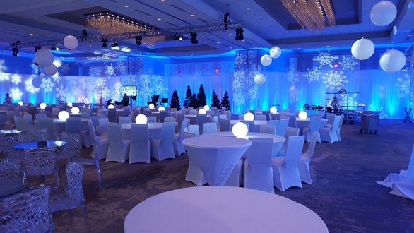 Winter theme lighting by Duluth Event Lighting. Up lighting in blue with snowflake gobos. Decor by Event Lab