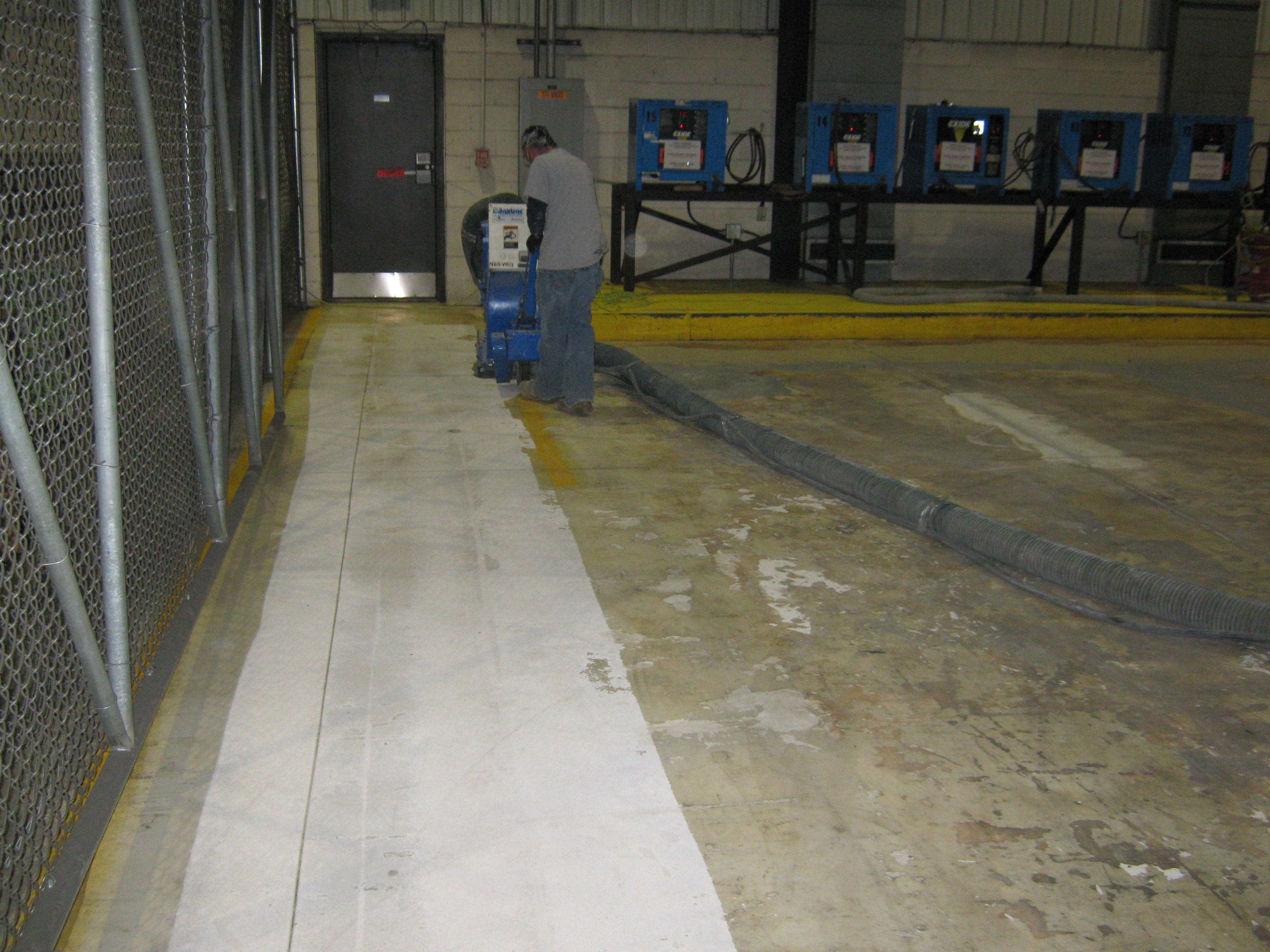 shot blasting concrete floor to prep for epoxy coating