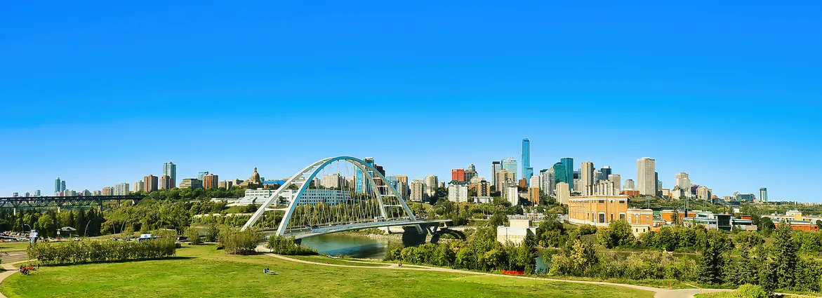 Edmonton skyline with White Bridge over river.