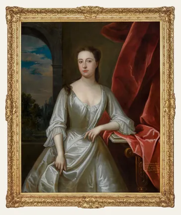 Three-quarter-length oil portrait of Lady Elizabeth Shirley (1678–1740), shown in a silver-white gown beside a marble table with crimson drapery