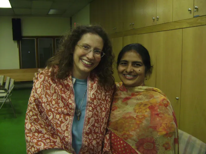 Marilynn Hughes (The Out-of-Body Travel Foundation) Received a shawl from Dr. Geetha Yeruva and Tom Chitta (The Foundation for Children in Need) for her help in