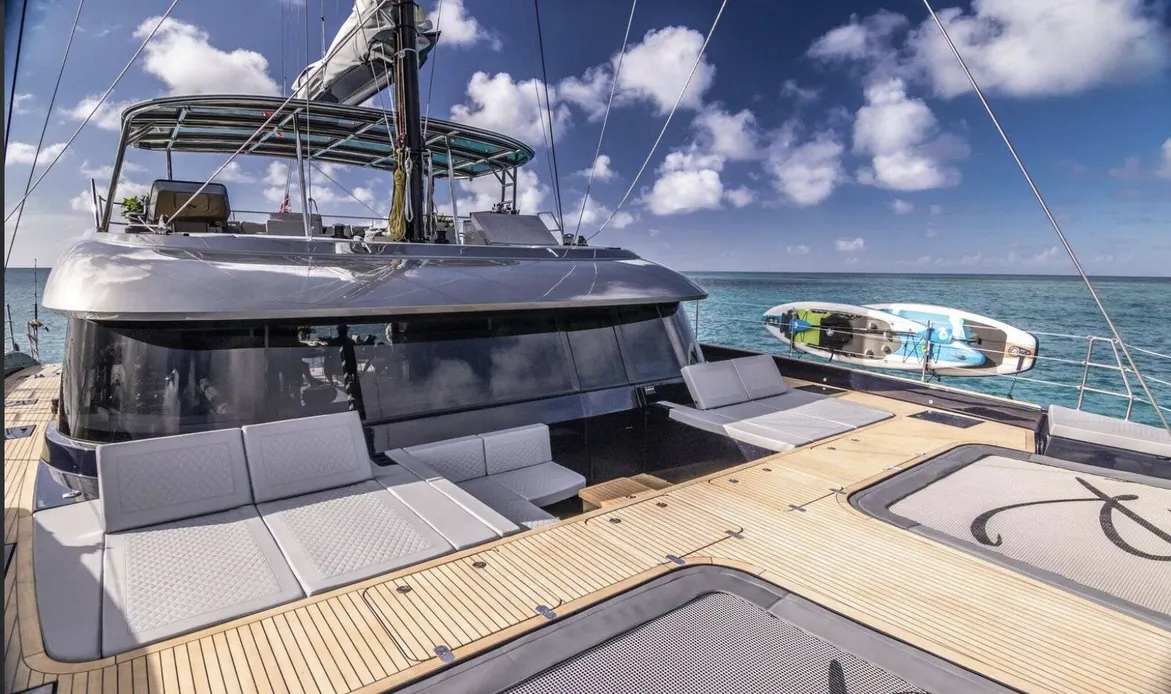 Luxurious catamaran deck featuring spacious lounge areas, overlooking